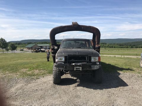 1989 Ford Bronco - This 1989 Ford Bronco has a unique metal structure attached over the cab.