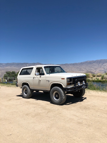 1981 Ford Bronco - This 1981 Ford Bronco, seen in a dry, outdoor setting, features off-road tires and a front brush guard, suggesting it is ready for adventur…