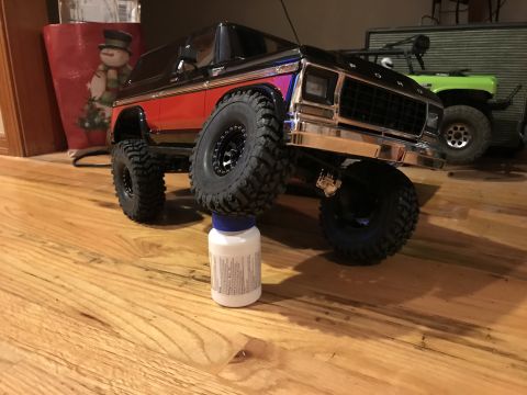 1989 Ford Bronco - This toy Bronco appears to be from the late 1970s, not a 1989 model as claimed, and is shown lifted on a bottle.