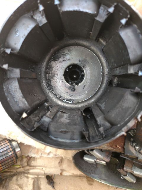 1989 Ford Probe - This is a close-up, overhead view of the interior of a metal component, possibly a motor housing, showing wear and grime.