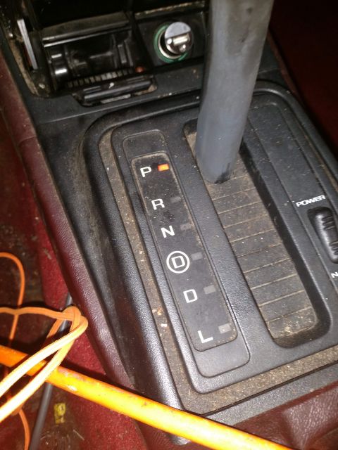1989 Ford Probe - The image shows a close-up view of an automatic transmission shifter console in a vehicle. The gear selector is currently in the 'P' (Park)…