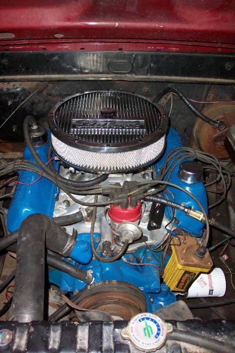 1968 Ford F-100 - Engine bay of a 1968 Ford F-100 shows blue valve covers and a chrome air cleaner assembly.