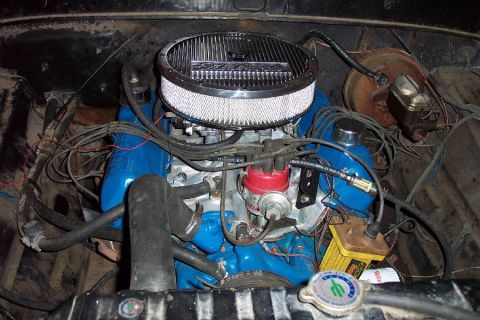 1968 Ford F-100 - Close-up view of an engine bay blue valve covers and a prominent chrome air filter assembly.