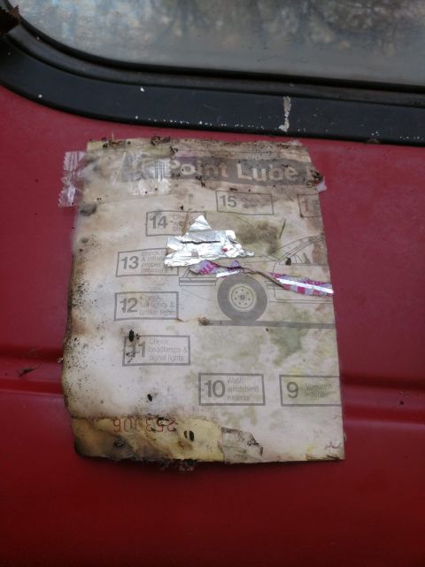 1989 Ford Probe - Degraded multi-point lube service checklist label showing numbered inspection items such as wash windshield and check lights.