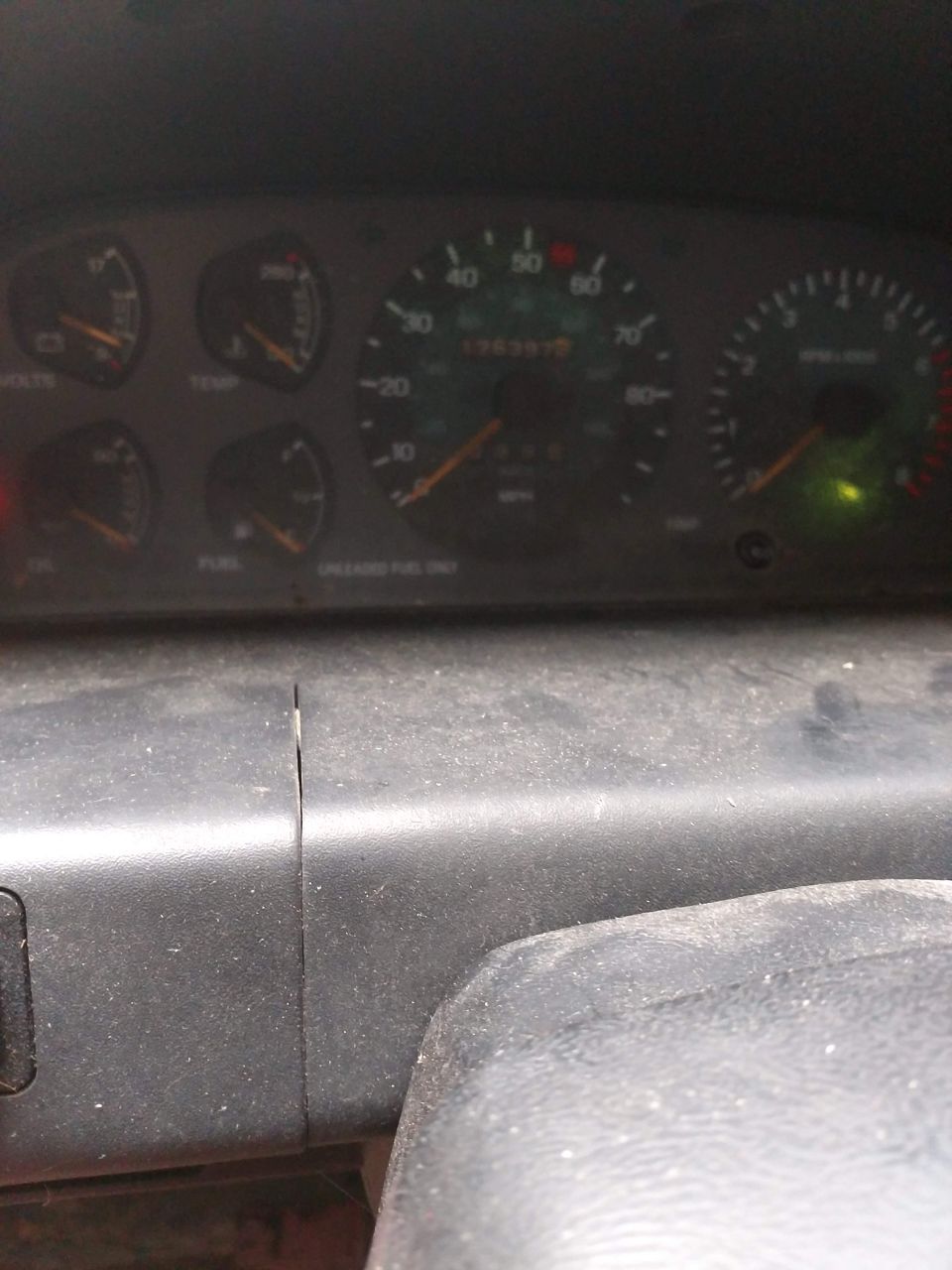 Dashboard with a digital display and a green indicator light