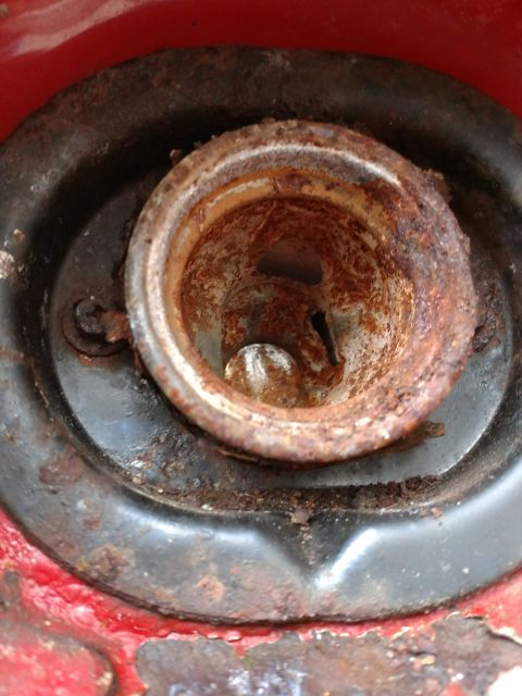 1989 Ford Probe - The fuel filler neck shows significant rust and corrosion, indicating potential repair needs.