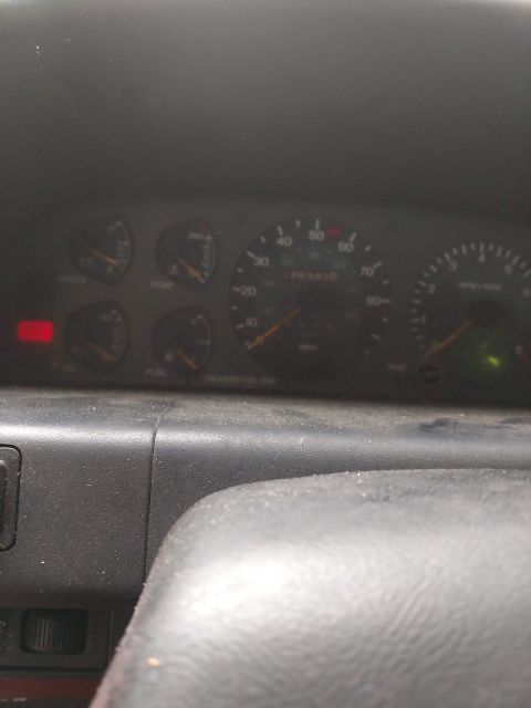 1989 Ford Probe - The vehicle's dashboard displays various gauges, including the odometer showing 76,337 miles.