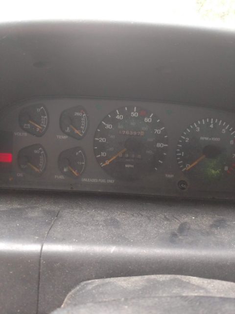 1989 Ford Probe - Interior view of a vehicle's dashboard, displaying various gauges and an odometer reading.