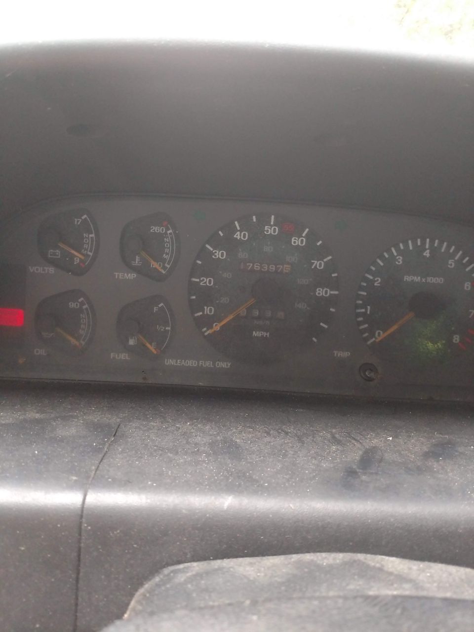 Vehicle dashboard with gauges for volts, temp, oil, fuel, speed, and RPM. Odometer reads 78357