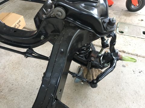 1967 Ford Galaxie - Front suspension assembly, likely from a classic car, undergoing restoration or repair.