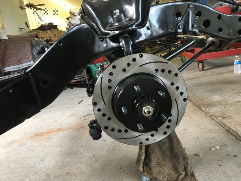 1967 Ford Galaxie - The vehicle's frame and braking system are visible, with a new rotor and caliper assembly.