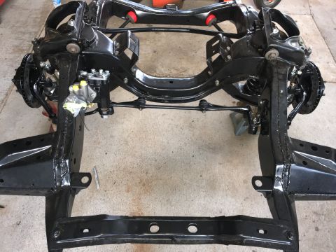 1967 Ford Galaxie - A vehicle chassis frame, likely from a classic car, is shown with its suspension and steering components.