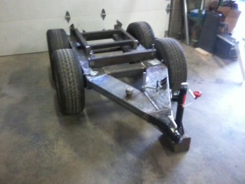 1984 Honda ATC 250 R - This is a custom-built trailer frame with four wheels and a hitch, shown indoors.