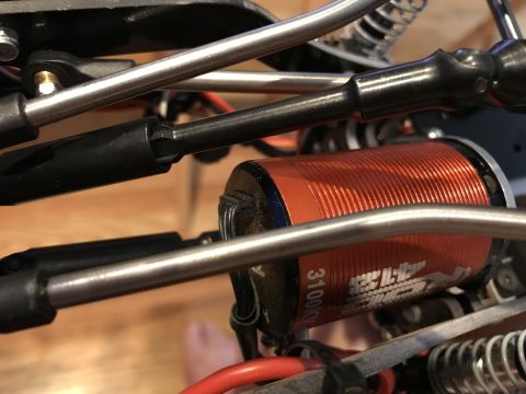 1989 Ford Bronco - Detail of an electric motor and RC car suspension components, not a 1989 Ford Bronco.