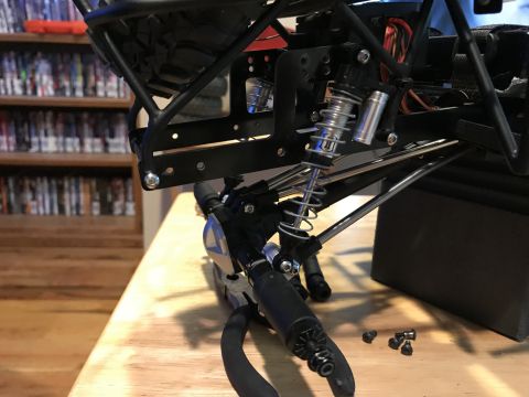 1989 Ford Bronco - Close-up view of a remote control car's suspension system and chassis components.