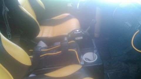 1978 Ford Bronco - Interior view of a vehicle's front seats and center console, showing custom upholstery.