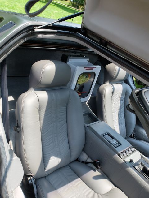 1971 Ford Ranchero - The interior of a DeLorean DMC-12 features gray leather seats and a distinctive center console.