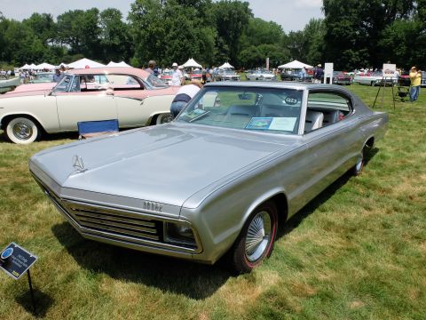 1971 Ford Ranchero - Silver 1966 Dodge Charger at an outdoor car show with other vehicles present.