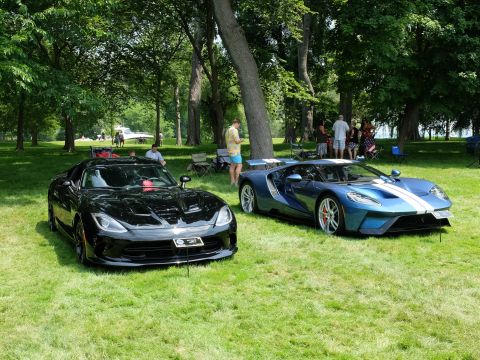 1971 Ford Ranchero - Two modern sports cars, a black Dodge Viper and a blue Ford GT, are displayed outdoors on a sunny day.