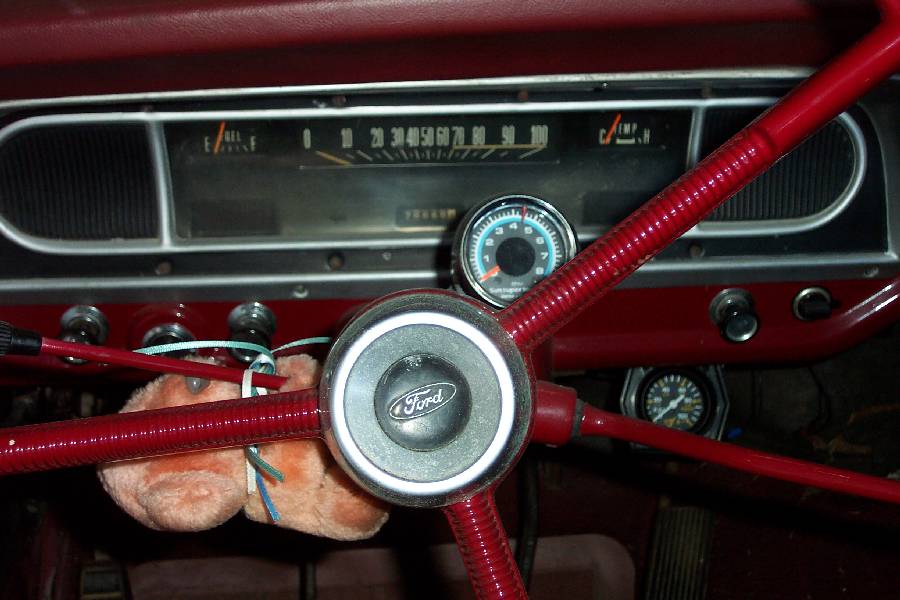Sun mini-tach, mechanical oil pressure gauge, and the Bog (stuffed animal) from the '67