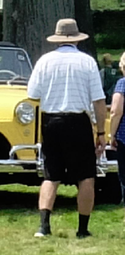 1971 Ford Ranchero - A yellow vehicle with a prominent chrome bumper and a single round headlight is visible in this front-facing photograph.