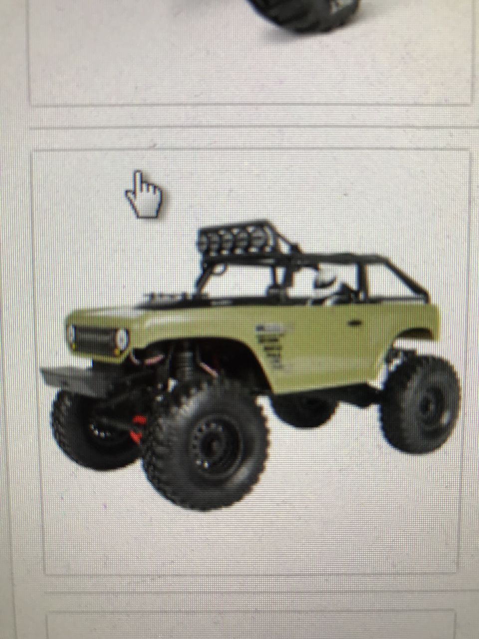Olive green off-road toy truck with roof rack and large tires