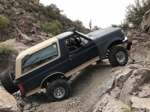 1991 Ford Bronco - This 1991 Ford Bronco is navigating a challenging off-road trail.
