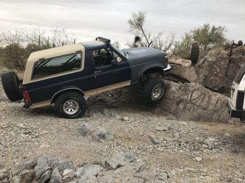 1991 Ford Bronco - This 1991 Ford Bronco navigates a rocky trail, its off-road capabilities.