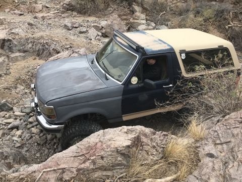 1991 Ford Bronco - This Ford Bronco is shown off-roading on a rocky trail.