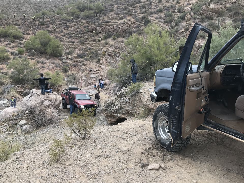 1991 Ford Bronco interior and front quarter view on off-road trail