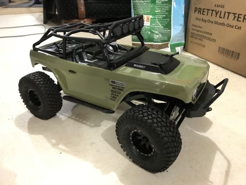 1989 Ford Bronco - This remote-controlled vehicle features a roll cage, off-road tires, and "DEADBOLT" branding on the hood.