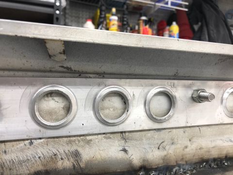 1992 Jeep Wrangler - Close-up view of a dashboard three circular gauge bezels and a protruding bolt.