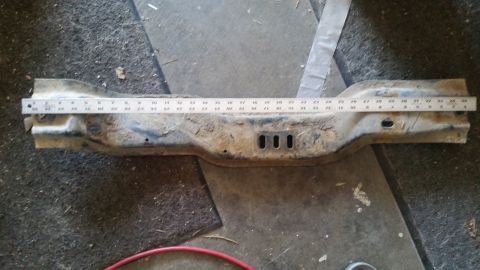 1985 Ford Bronco - Metal crossmember with ruler for scale. Album claims 1985 Ford Bronco part.