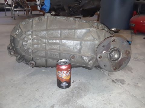 1996 Ford F-350 - Transfer case with '61A' casting mark, shown next to a Dr. Pepper can for size reference.