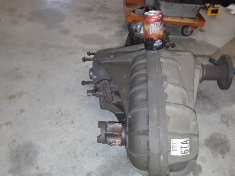 1996 Ford F-350 - Transfer case assembly shown with a Dr. Pepper can on top. Label reads '6TA'.
