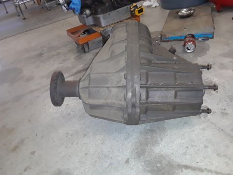 1996 Ford F-350 - Transfer case part shown on a concrete floor in a workshop setting. The registry claims it is from a 1996 Ford F-350.