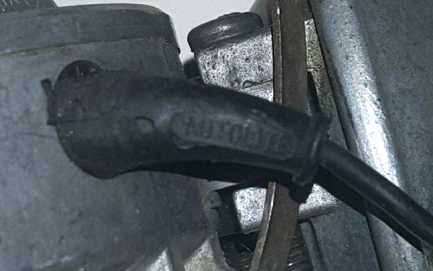Spark plug wire boot with embossed text 'AUTOLITE 76'