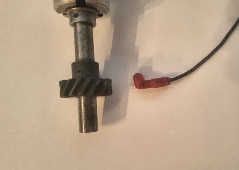 1973 Ford Mustang - A close-up view of an automotive distributor part.