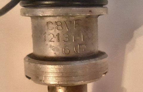 1973 Ford Mustang - Close-up of a distributor cap, showing some part numbers. The registry information for this image may be incorrect.