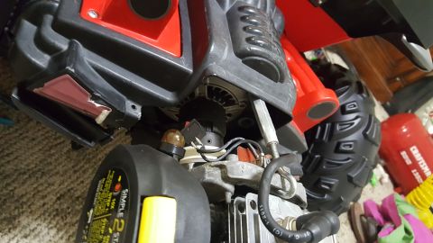 2007 Subaru Impreza - Close-up view of a toy vehicle's engine and tire, showing mechanical details and a red body component.