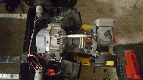 2007 Subaru Impreza - Generator engine and alternator assembly with wiring and metal frame, top view.