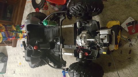 2007 Subaru Impreza - The chassis of a toy vehicle is shown disassembled, revealing its engine and electrical components.