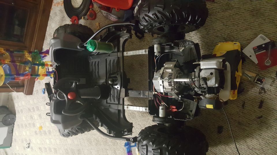 Toy vehicle chassis with exposed engine and large tires