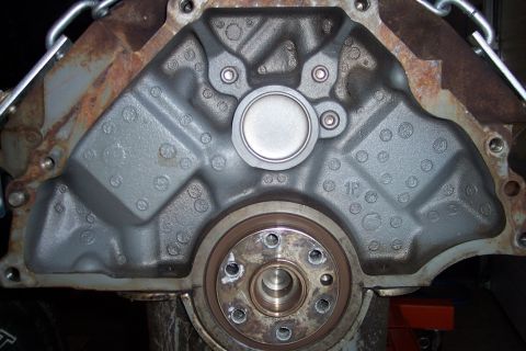 1995 Ford Bronco - Engine block part shown with a crankshaft seal and a circular metal plate.
