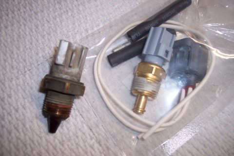 1995 Ford Bronco - Two coolant temperature sensors are shown, along with associated wiring and heat shrink tubing.