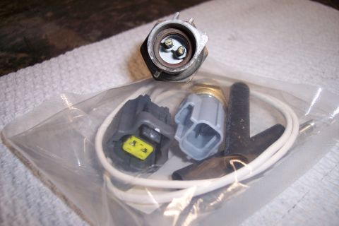 1995 Ford Bronco - This photo shows a new engine coolant temperature sensor with its associated electrical connectors and wiring.