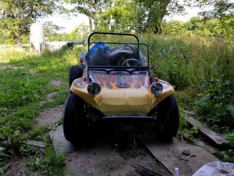 1968 Ford Mustang - Custom dune buggy with flame graphics parked on wooden planks in a grassy area.