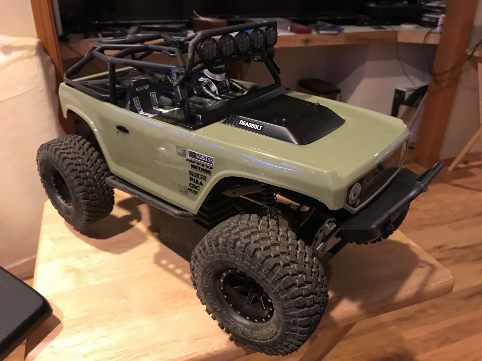 RC rock crawler toy truck with roll cage and large tires