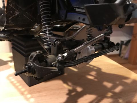 1989 Ford Bronco - The detailed view of a vehicle's suspension system shows complex mechanical components.