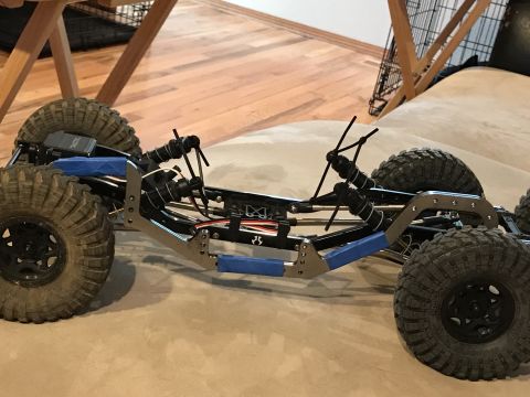 1989 Ford Bronco - RC crawler chassis with large tires and suspension components visible.